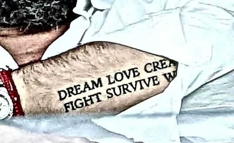 Βαγγέλης Μαρινάκης τατουάζ dream love create fight survive win
